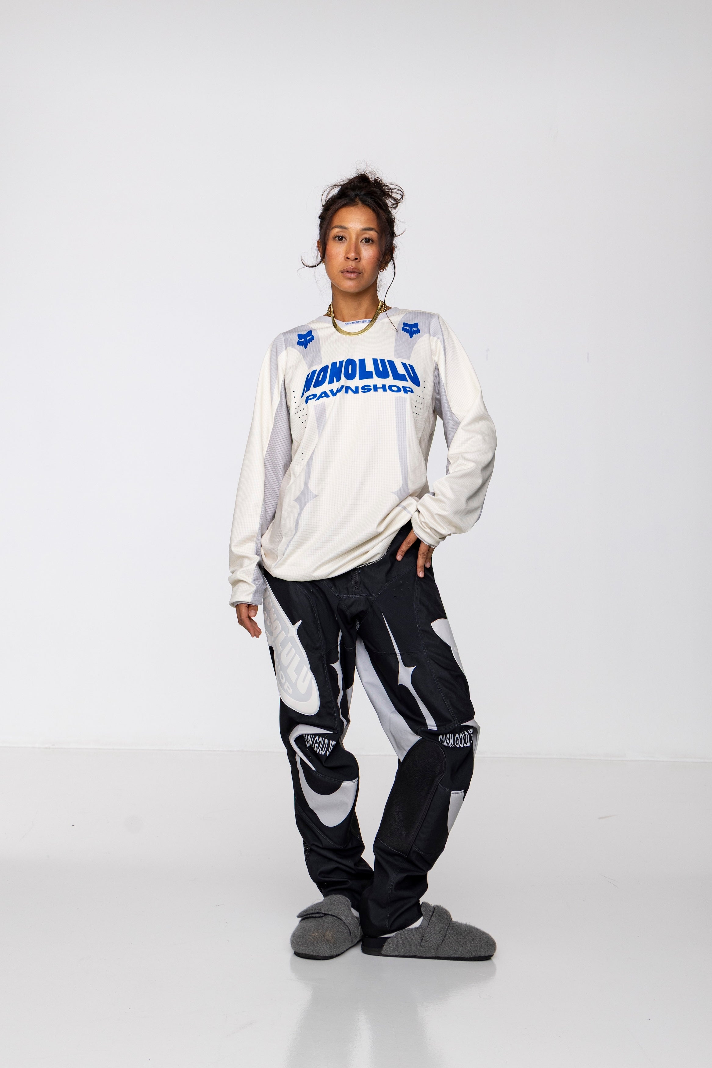 Model wearing all-terrain riding pants. Built for track and mountains, featuring durable Polyester/Cow Leather blend.